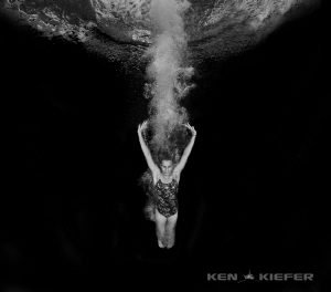 Diver completing a double flip with twist by Ken Kiefer 
